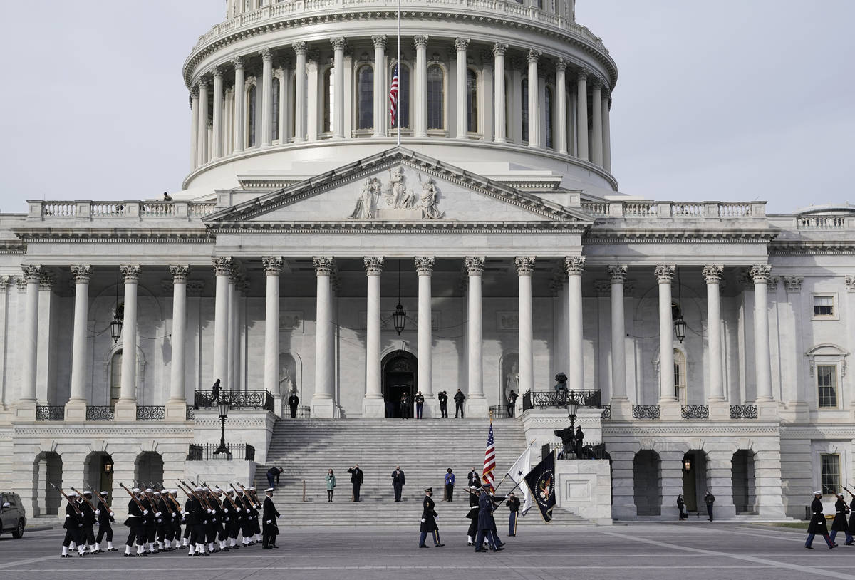 U.S. military units march in front of the Capitol, Monday, Jan. 18, 2021 in Washington, as they ...