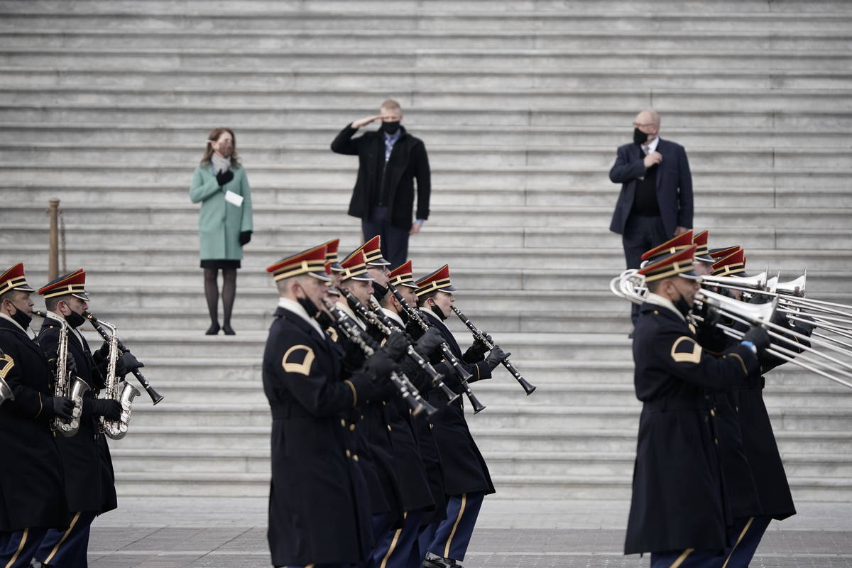 U.S. military units march in front of the Capitol, Monday, Jan. 18, 2021 in Washington, as they ...