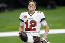 Tampa Bay Buccaneers quarterback Tom Brady smiles after an NFL divisional round playoff footbal ...