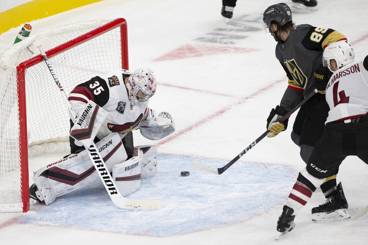 Arizona Coyotes' goaltender Darcy Kuemper (35) saves a shot on goal from the Golden Knights dur ...