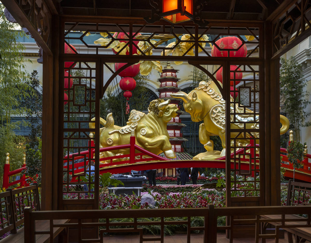 A gazebo and golden ox couple looking at each other lovingly as the Bellagio Conservatory & Bot ...
