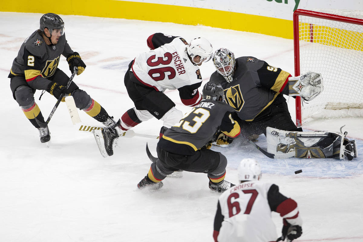 Golden Knights' goaltener Robin Lehner (90) saves a shot on goal from Arizona Coyotes' right wi ...