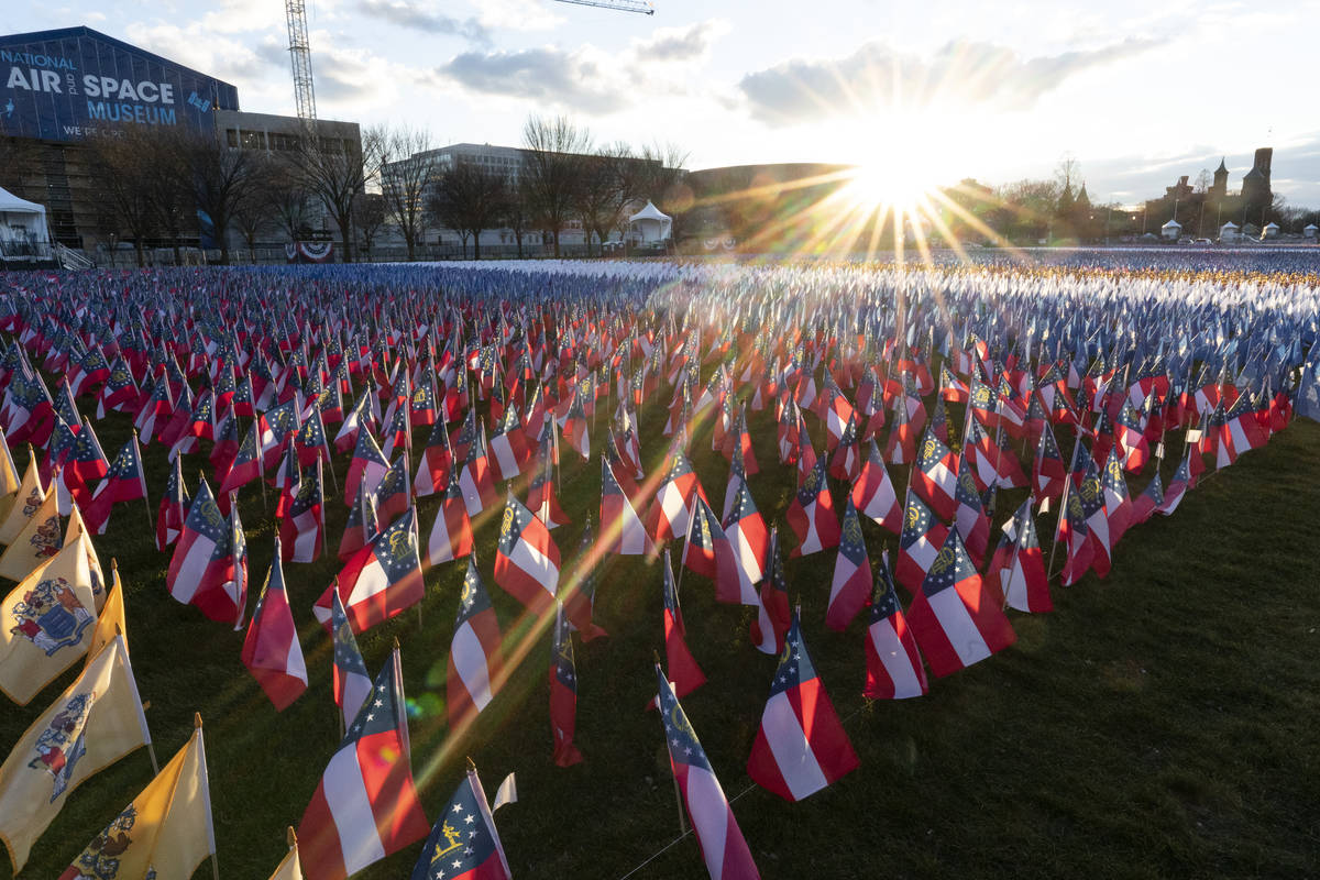 Flags are placed on the National Mall ahead of the inauguration of President-elect Joe Biden an ...