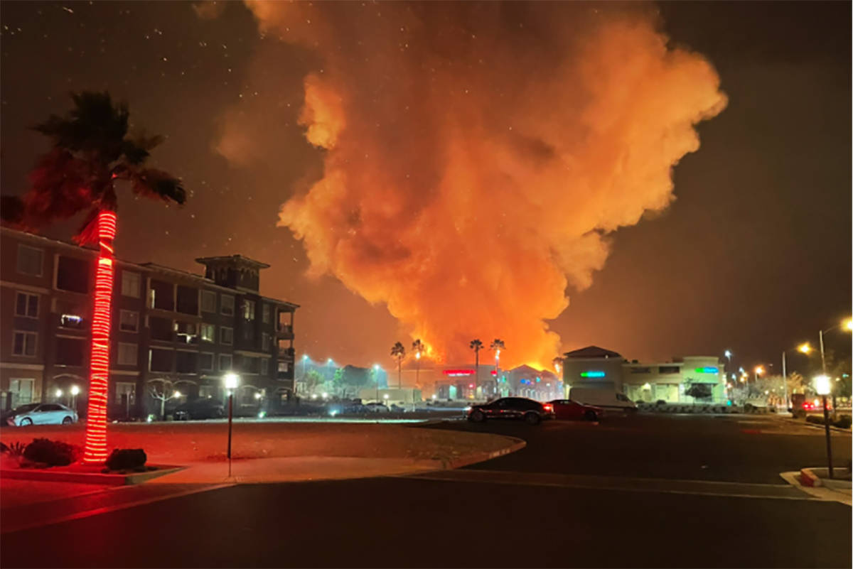 Fire crews battle a large fire in southwest Las Vegas early Tuesday, Jan. 19, 2021. (Dominic Gi ...