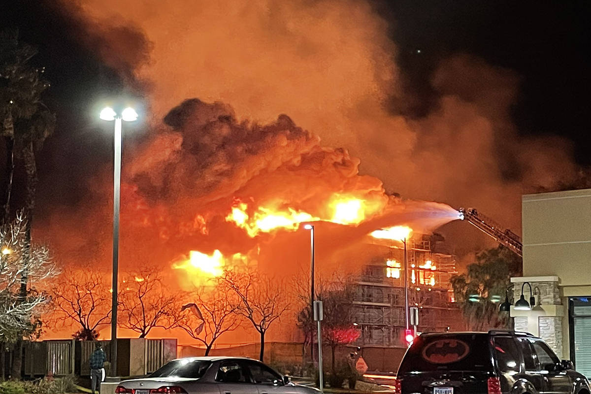 Fire crews battle a large fire in southwest Las Vegas early Tuesday, Jan. 19, 2021. (Dominic Gi ...