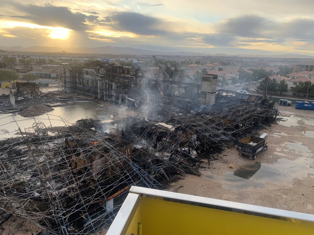 The aftermath of an overnight fire at an under-construction apartment complex in southwest Las ...
