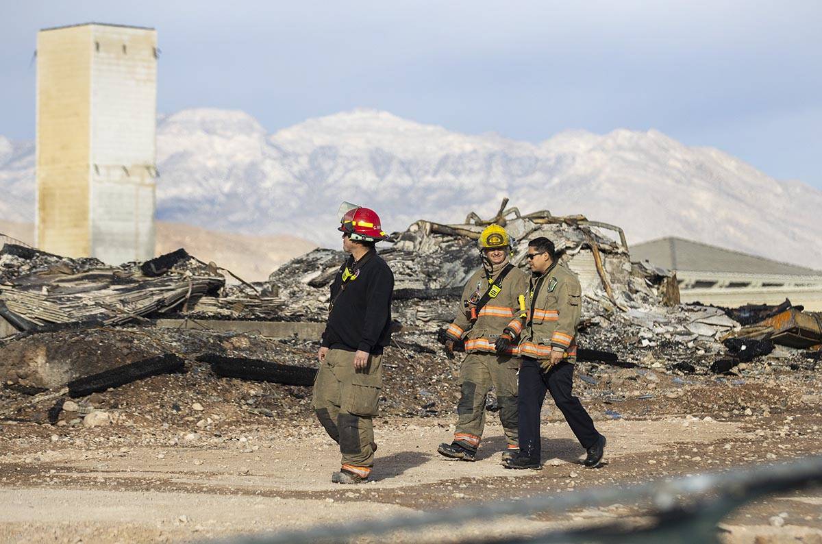 Clark County firefighters survey the damage done by fire to an under-construction Ely at Fort A ...