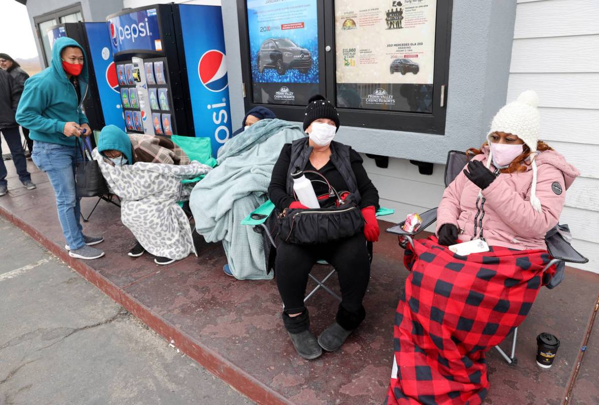 Valerie Simpson of Las Vegas, right, and Tonya Hayes of Pahrump line up to buy Powerball and Me ...
