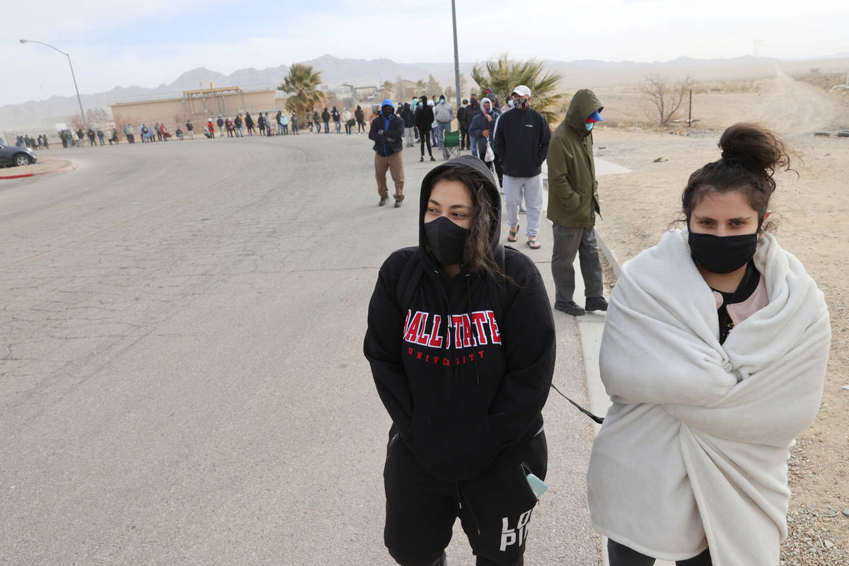 Sisters Fadia Salman, 25, left, and Hilda Salman, 23, both of Las Vegas, line up to buy Powerba ...