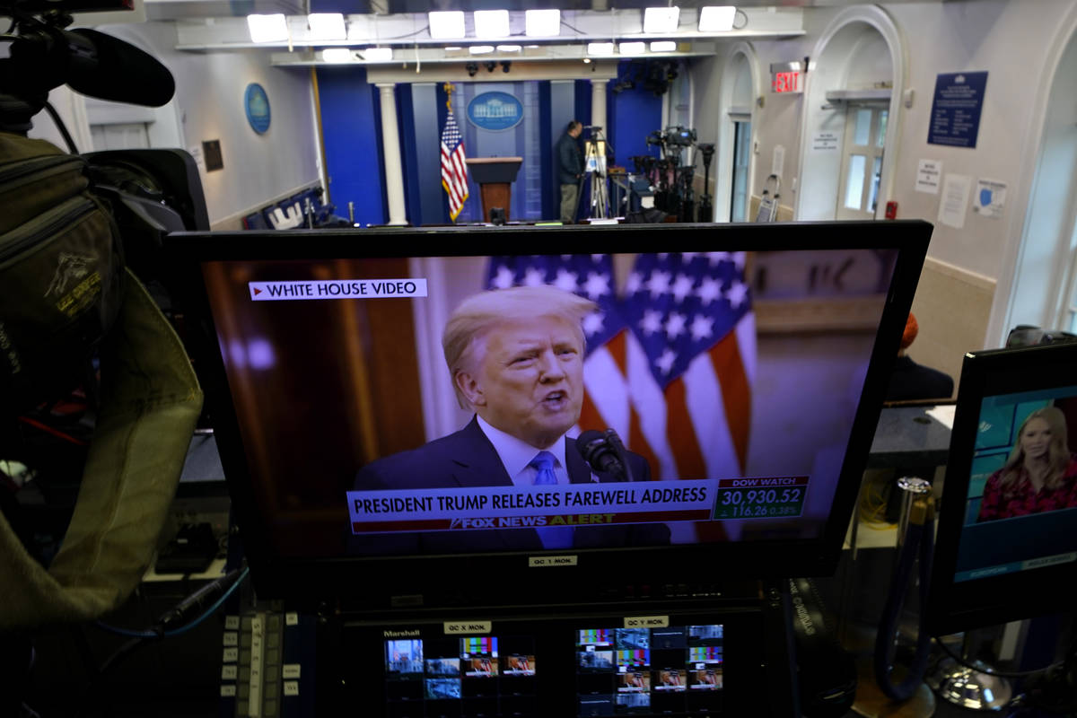 President Trump is seen on a network monitor after his pre-recorded farewell speech was release ...