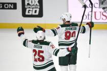 Minnesota Wild center Marcus Johansson, right, celebrates his game-winning goal in front of Jon ...