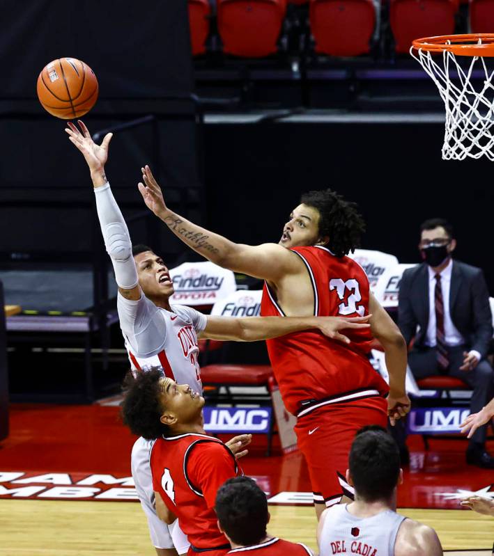 UNLV Rebels guard Nick Blake (22) shoots over Benedictine Mesa Redhawks' Maurice Walton (32) du ...