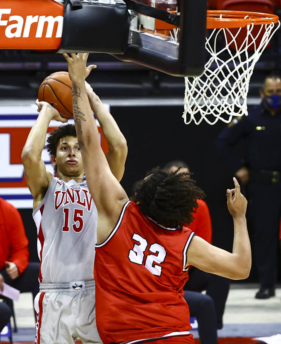 UNLV Rebels forward Reece Brown (15) looks to take a shot over Benedictine Mesa Redhawks' Mauri ...