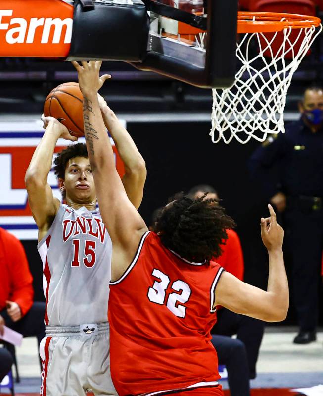 UNLV Rebels forward Reece Brown (15) looks to take a shot over Benedictine Mesa Redhawks' Mauri ...