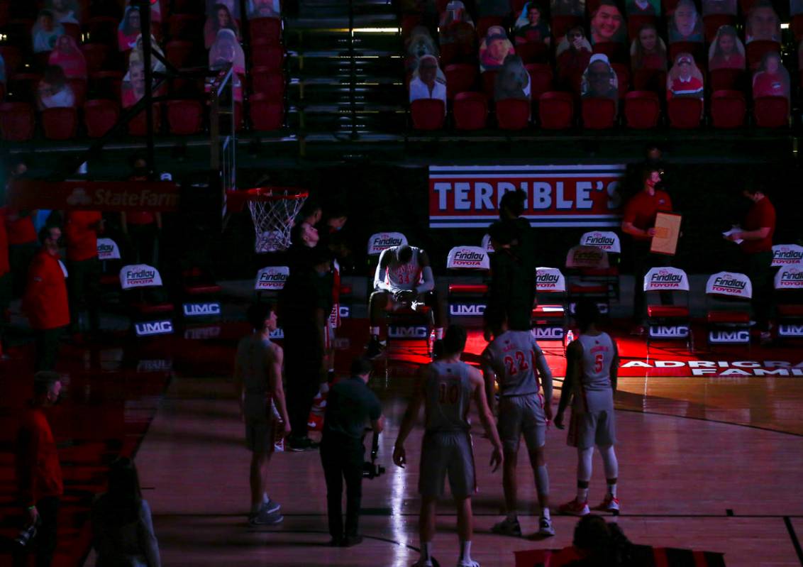 Light shines on UNLV Rebels forward Cheikh Mbacke Diong (34) as players are introduced before a ...