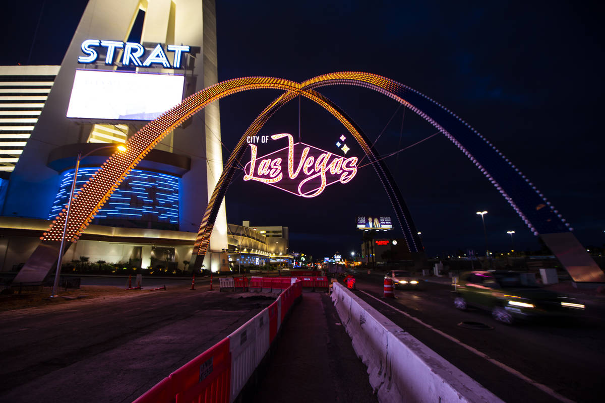 Amber lights illuminate the gateway arches in downtown Las Vegas as part of a remembrance for v ...