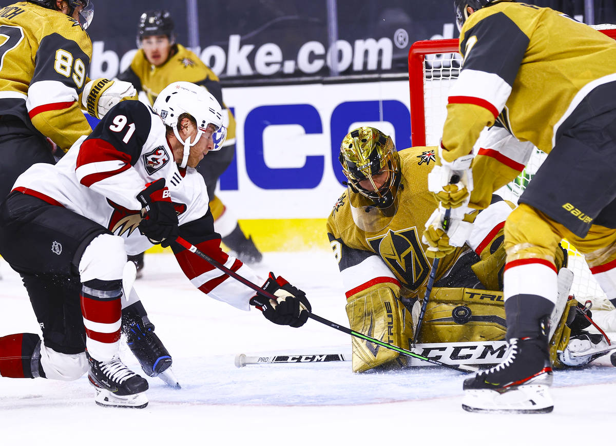 Golden Knights goaltender Marc-Andre Fleury (29) blocks the puck in front of Arizona Coyotes ce ...