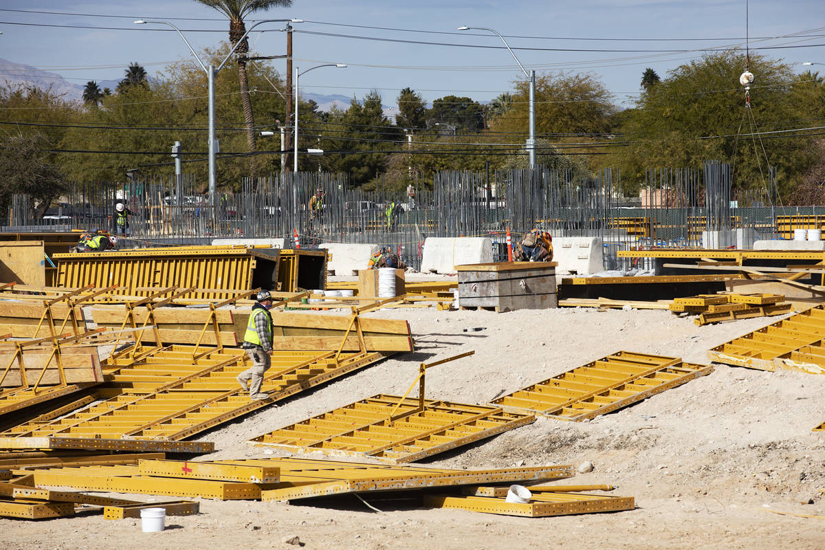 Construction workers work on the future medical education building for UNLV’s School of Medic ...