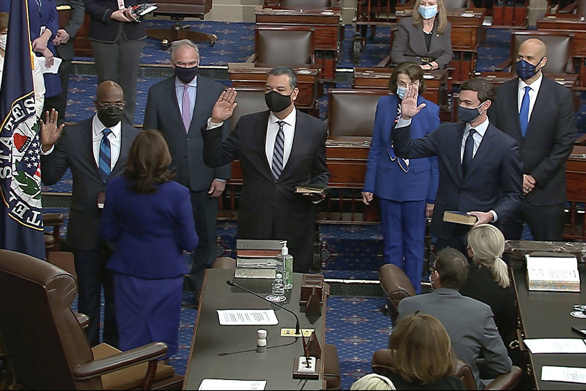 In this image from video, Vice President Kamala Harris swears in Sen. Raphael Warnock, D-Ga., S ...