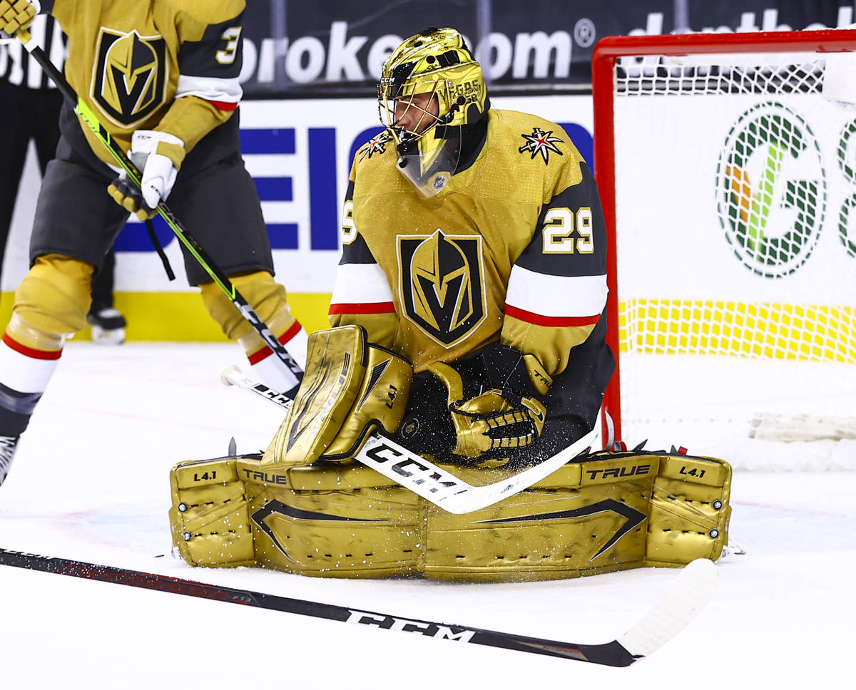 Golden Knights goaltender Marc-Andre Fleury (29) blocks a shot from the Arizona Coyotes during ...