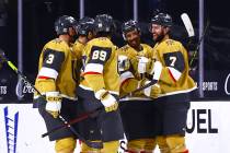 Golden Knights defenseman Alex Pietrangelo (7) celebrates his goal with teammates during the fi ...