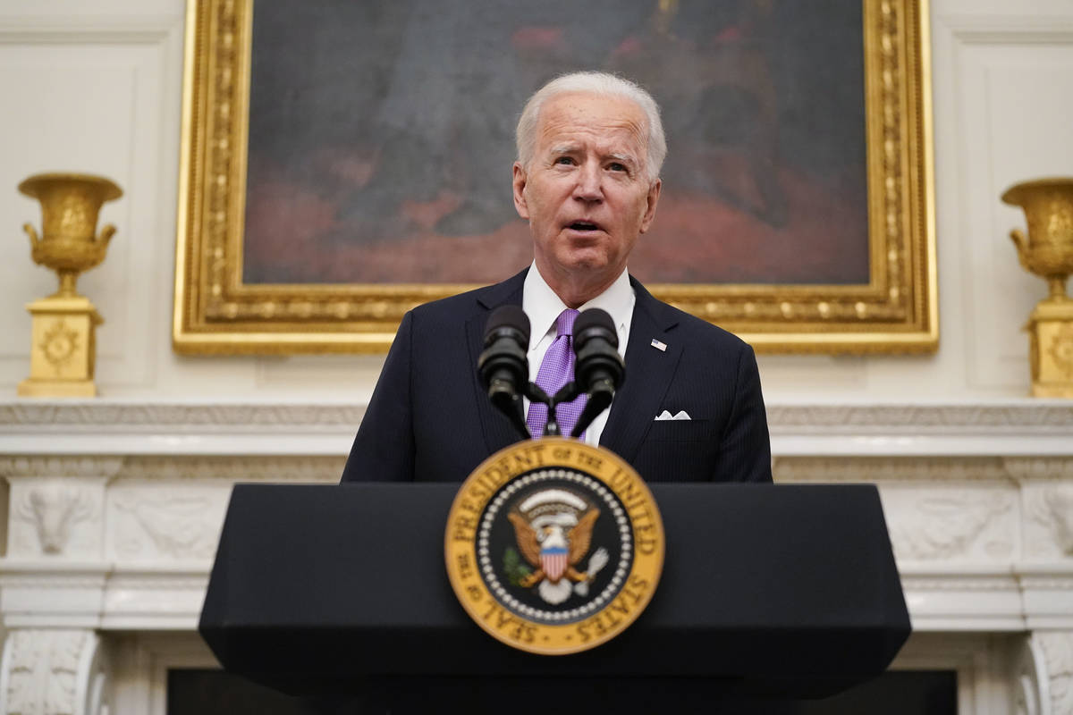 President Joe Biden speaks about the coronavirus in the State Dinning Room of the White House, ...
