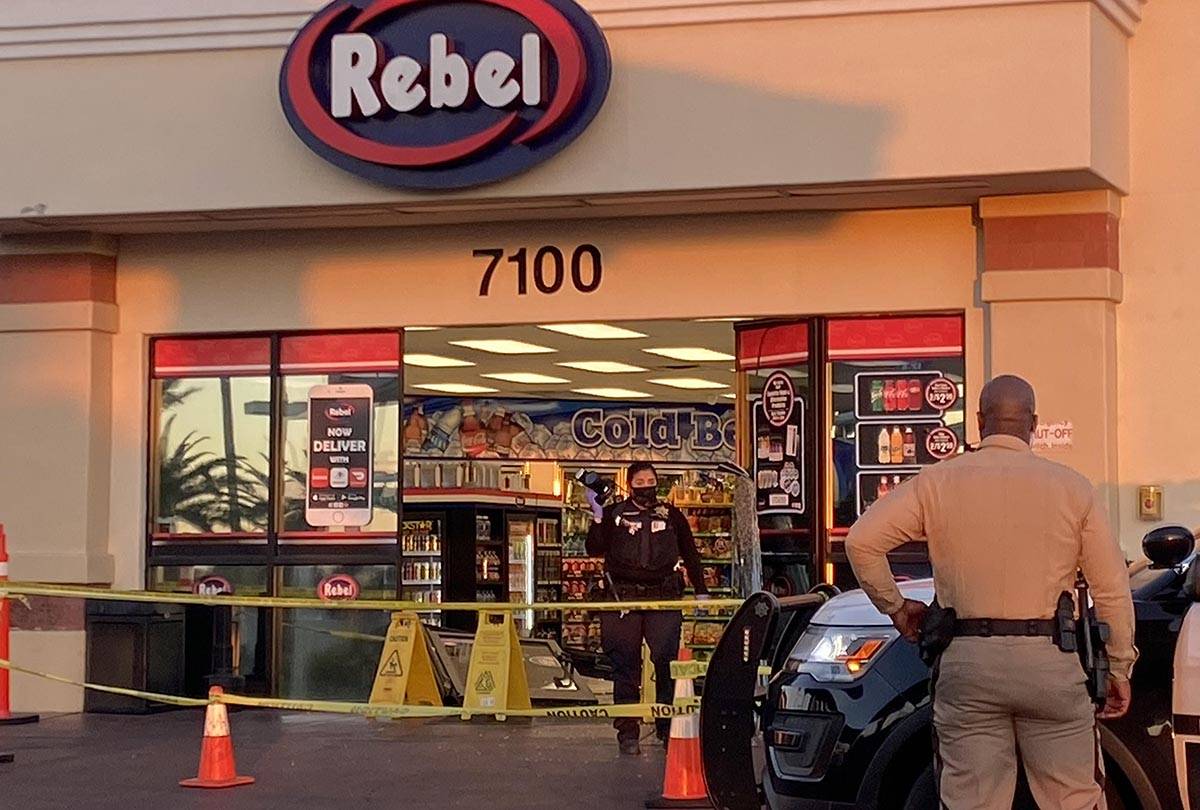 Las Vegas police investigate where a man drove his vehicle into the front doors of an Arco Rebe ...