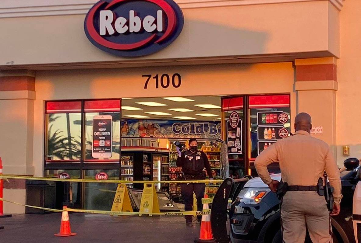 Las Vegas police investigate where a man drove his vehicle into the front doors of an Arco Rebe ...