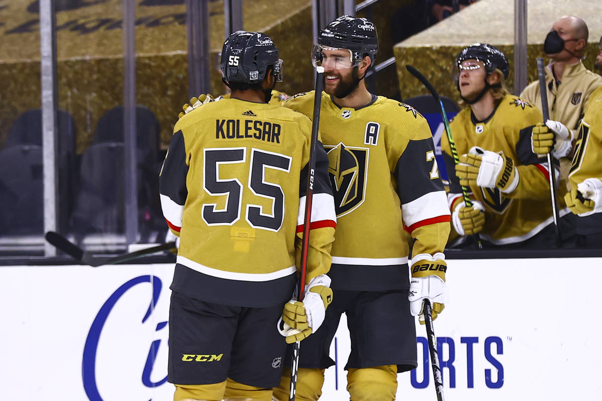 Golden Knights defenseman Alex Pietrangelo (7) celebrates his goal with right wing Keegan Koles ...