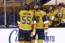 Golden Knights defenseman Alex Pietrangelo (7) celebrates his goal with right wing Keegan Koles ...