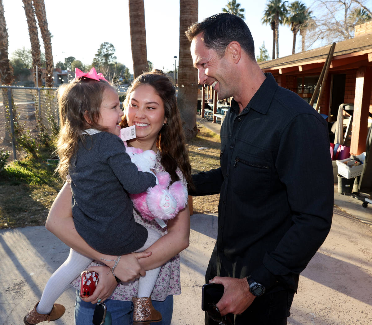 Kyle Kimoto visits with his daughter Kahlea Kimoto, 20, and granddaughter Ophelia Oswald, 3, at ...