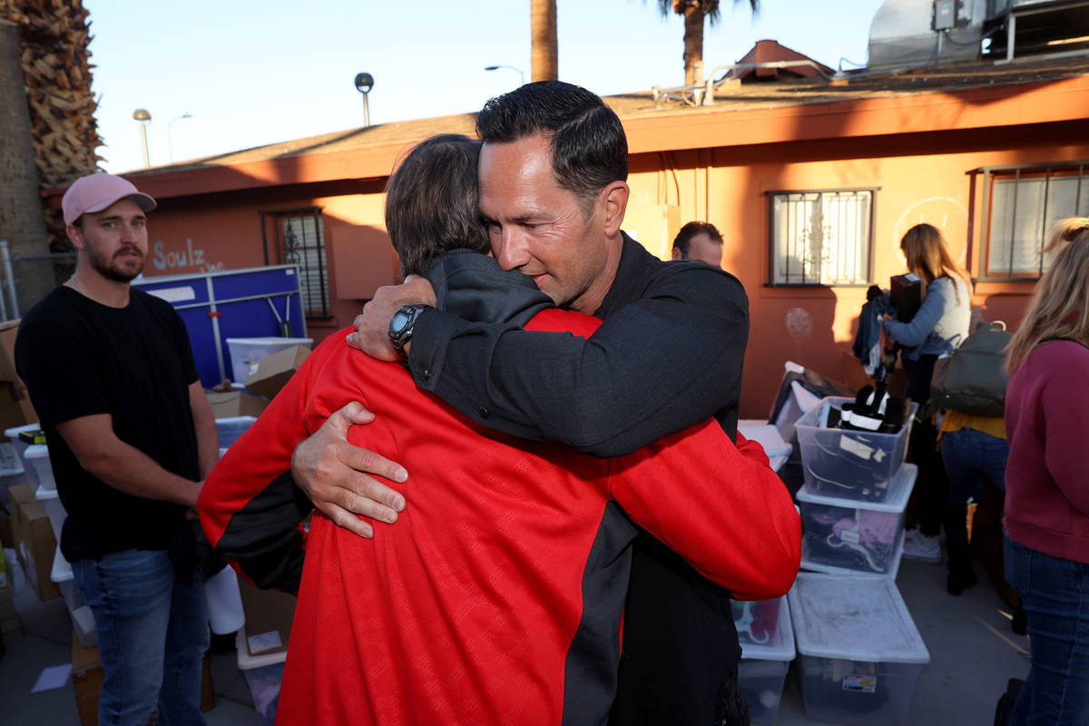 Kyle Kimoto, right, hugs foundation co-founder Ryan Wolfington at Jewel's Marty Hennessy Inspir ...