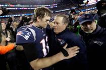 In this Jan. 21, 2018, file photo, New England Patriots quarterback Tom Brady, left, hugs coach ...