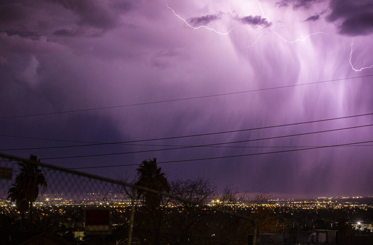 Lightning lights up the sky as rain comes down in east Las Vegas on Friday, Jan. 22, 2021. (Cha ...
