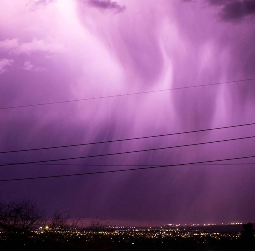 Lightning lights up the sky as rain comes down in east Las Vegas on Friday, Jan. 22, 2021. (Cha ...