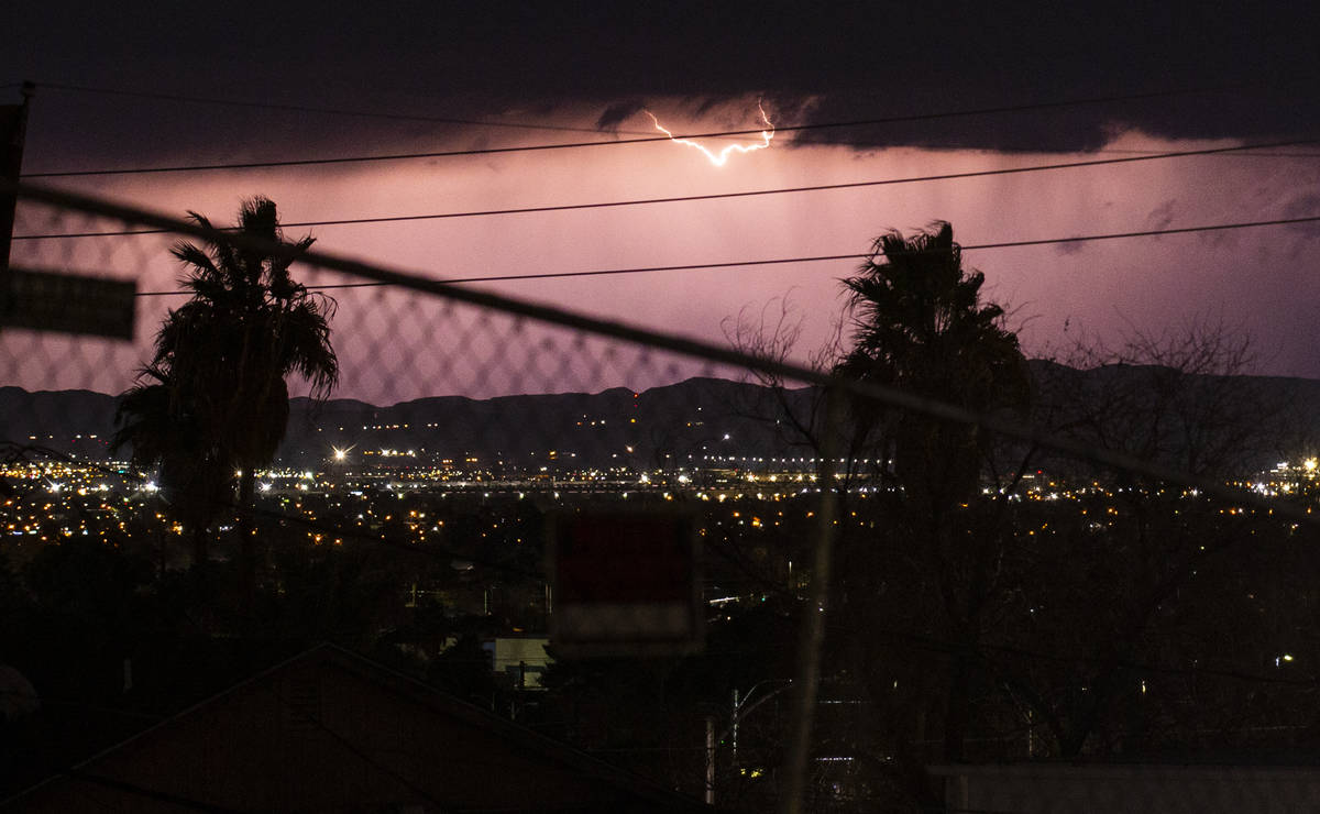Lightning lights up the sky as rain comes down in east Las Vegas on Friday, Jan. 22, 2021. (Cha ...