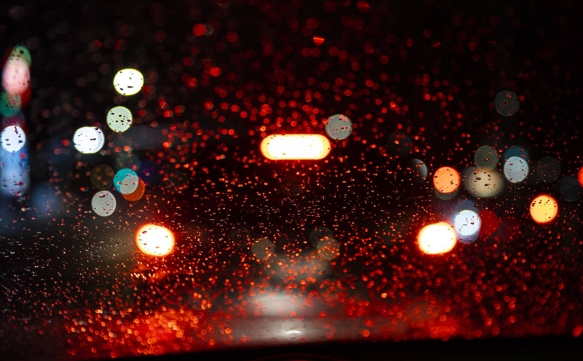 Raindrops are seen on a windshield in Las Vegas on Friday, Jan. 22, 2021. (Chase Stevens/Las Ve ...