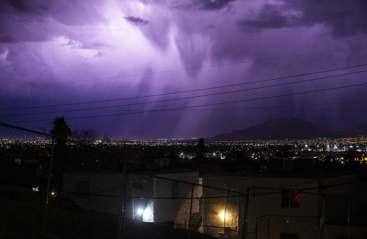 Lightning lights up the sky as rain comes down in east Las Vegas on Friday, Jan. 22, 2021. (Cha ...