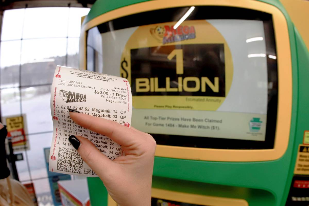 A patron, who did not want to give her name, shows the ticket she had just bought for the Mega ...