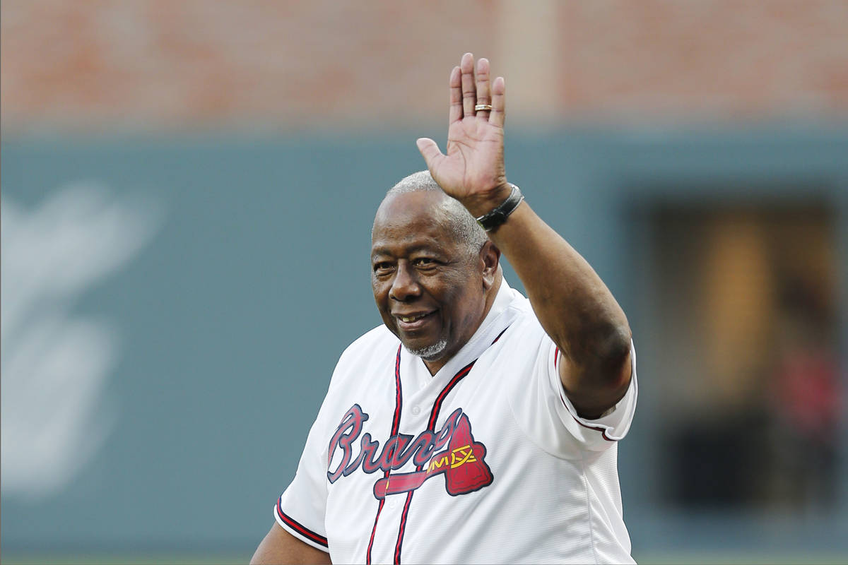 Former Atlanta Braves' Hank Aaron is honored during a ceremony before a baseball game between t ...
