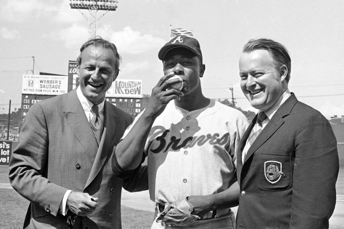 FILE - In this May 17, 1970, file photo, Atlanta Braves' Hank Aaron, center, who became the nin ...