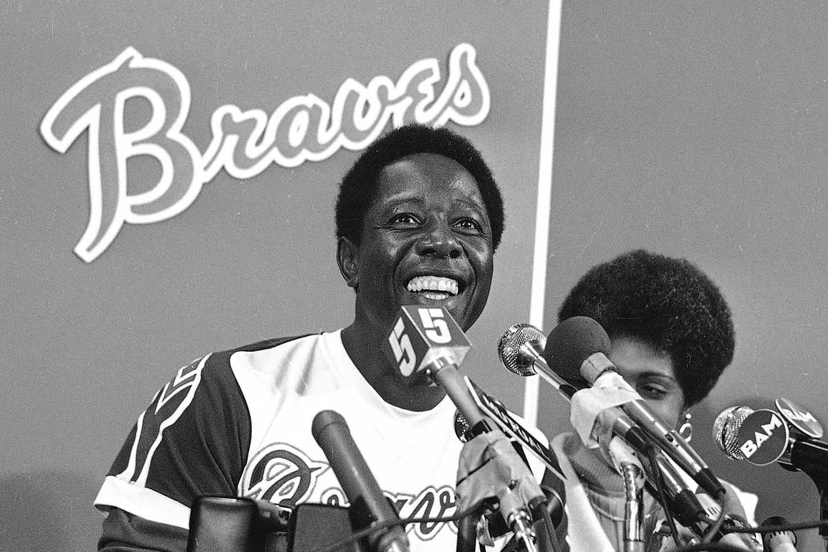 FILE - Atlanta Braves' Hank Aaron smiles during a press conference at Atlanta Stadium, Ga., aft ...
