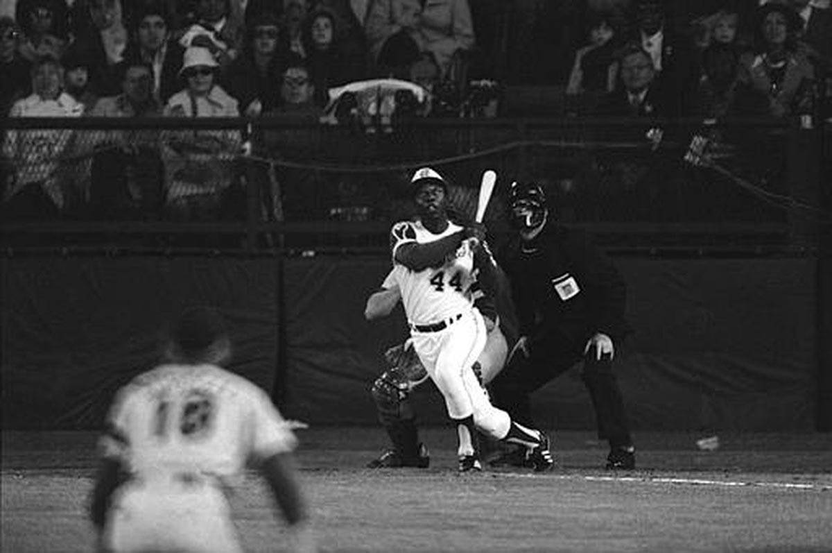 Hank Aaron hits his 715th career home run on April 18, 1974, topping Babe Ruth's record. (AP file)