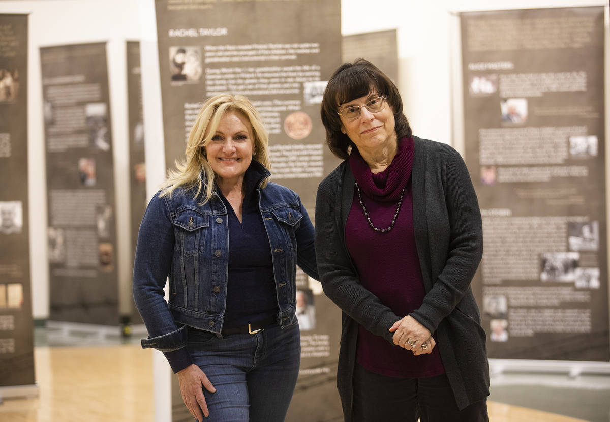 Heidi Sarno Straus, left, exhibit co-creator and chair of the Holocaust Education Task Force, a ...