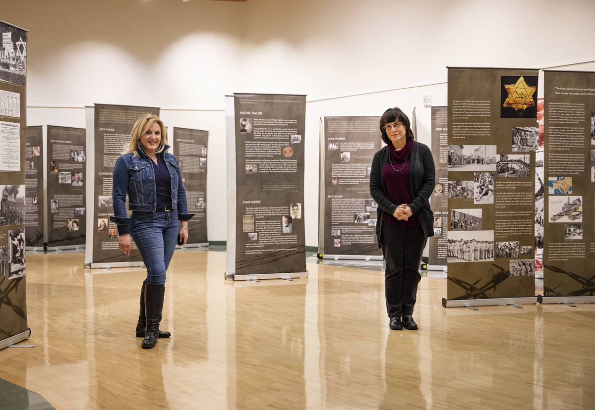 Heidi Sarno Straus, left, exhibit co-creator and chair of the Holocaust Education Task Force, a ...