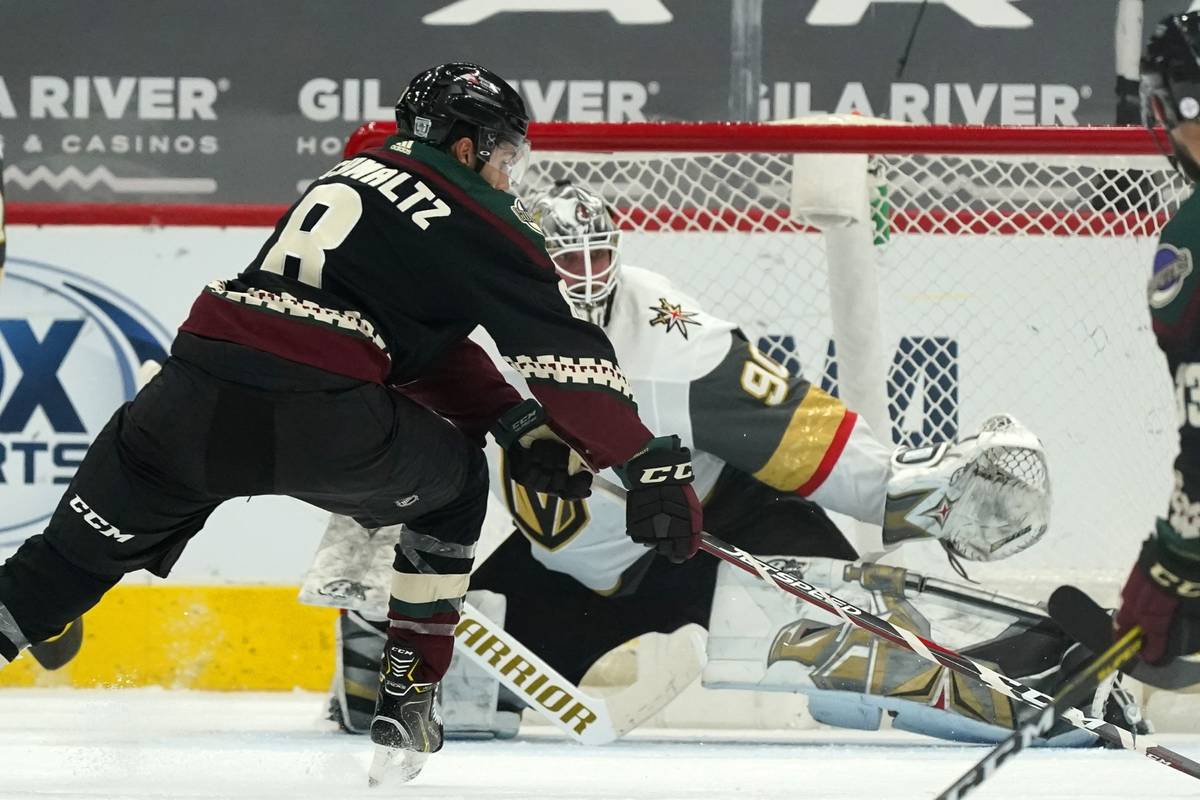 Arizona Coyotes center Nick Schmaltz (8) beats Vegas Golden Knights goaltender Robin Lehner (90 ...
