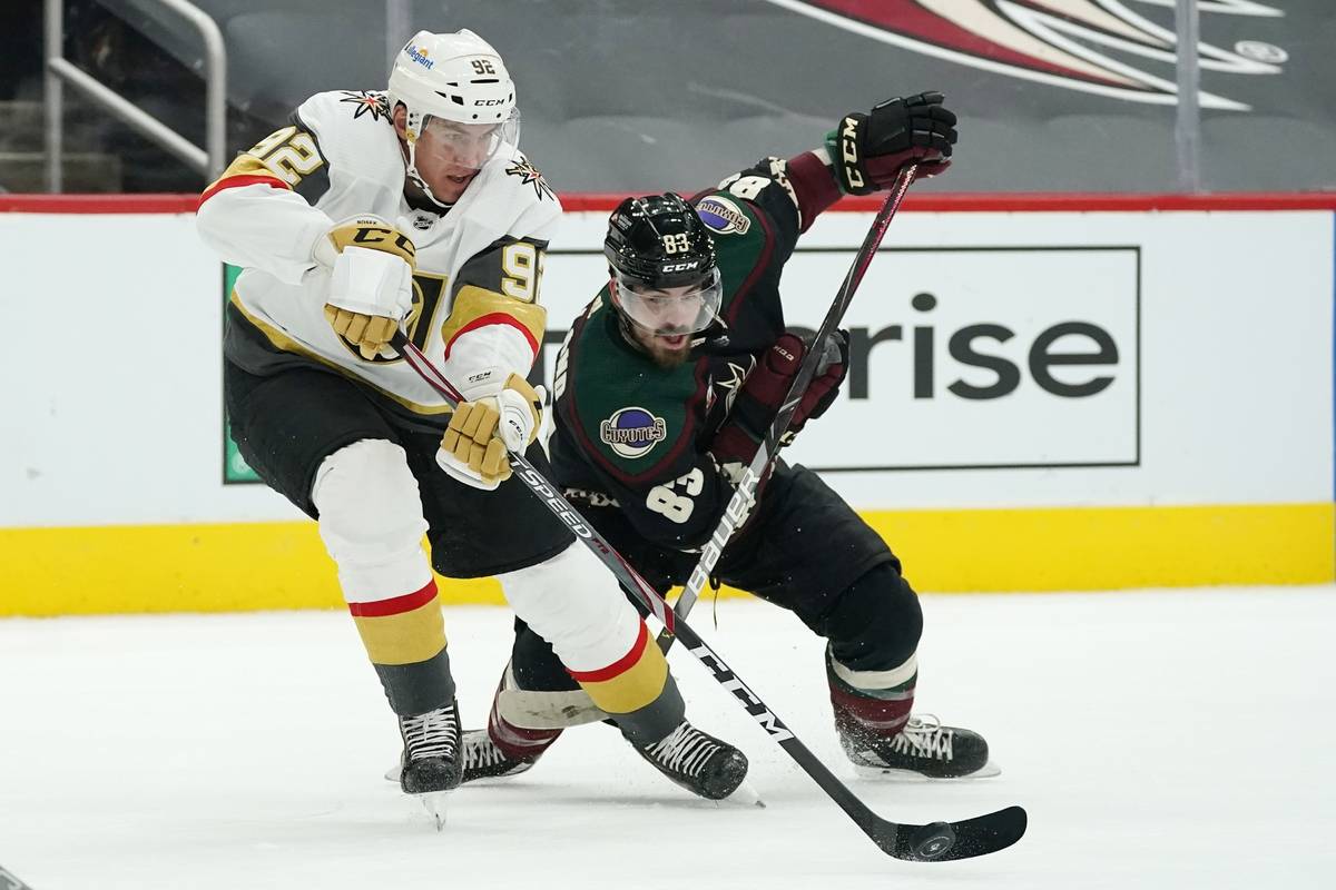 Vegas Golden Knights left wing Tomas Nosek (92) controls the puck in front of Arizona Coyotes r ...