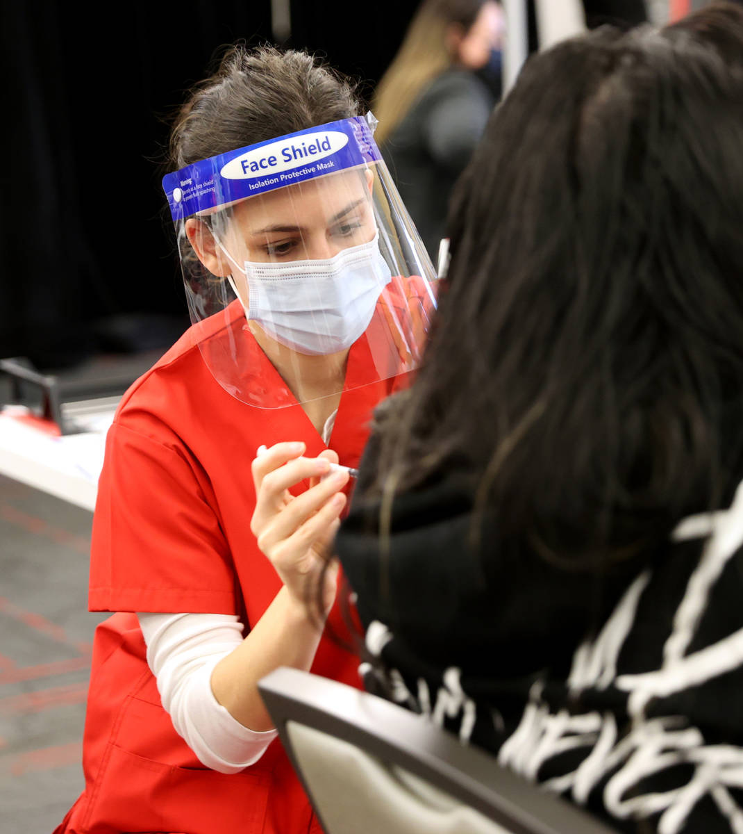 Nursing student Stephanie Soiberg gives a COVID-19 vaccine during a UNLV Medicine clinic in the ...