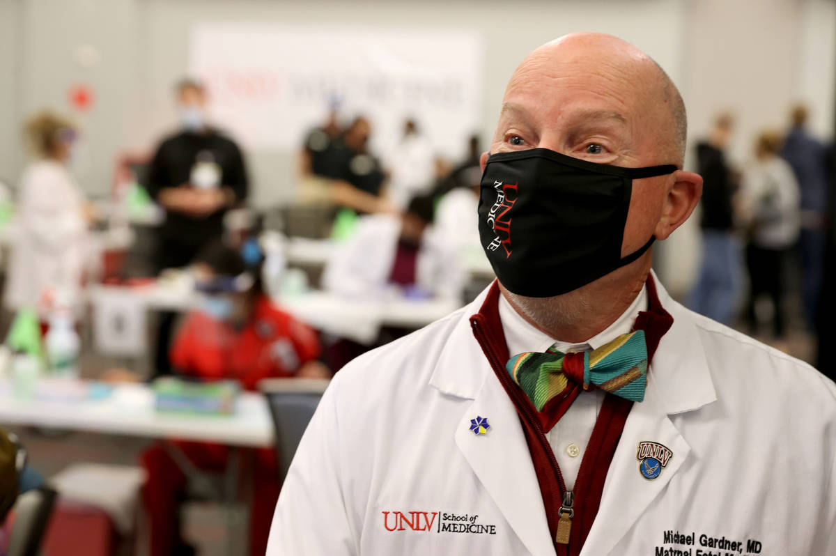 Dr. Michael Gardner, Vice Dean of Clinical Affairs at UNLV School of Medicine, talks to a repor ...