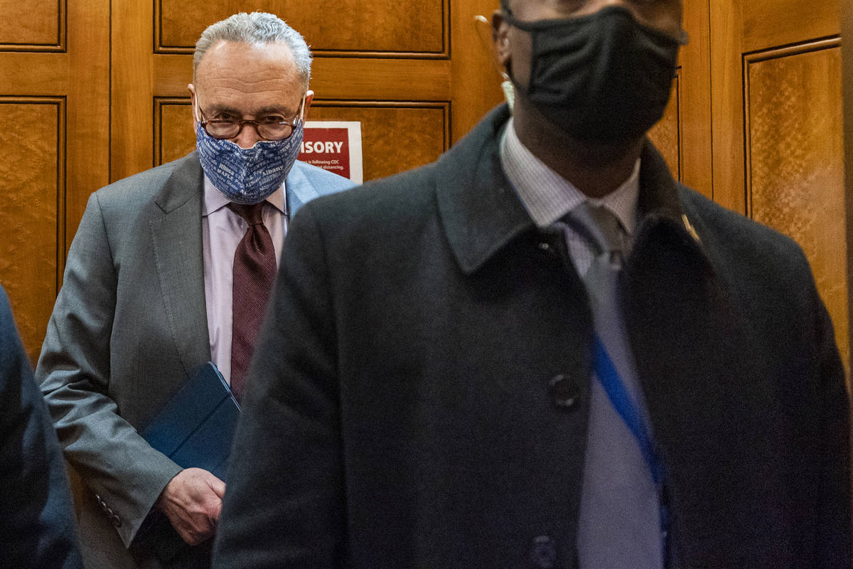 Senate Majority Leader Chuck Schumer of N.Y, takes the elevator in the U.S. Capitol , Friday, J ...